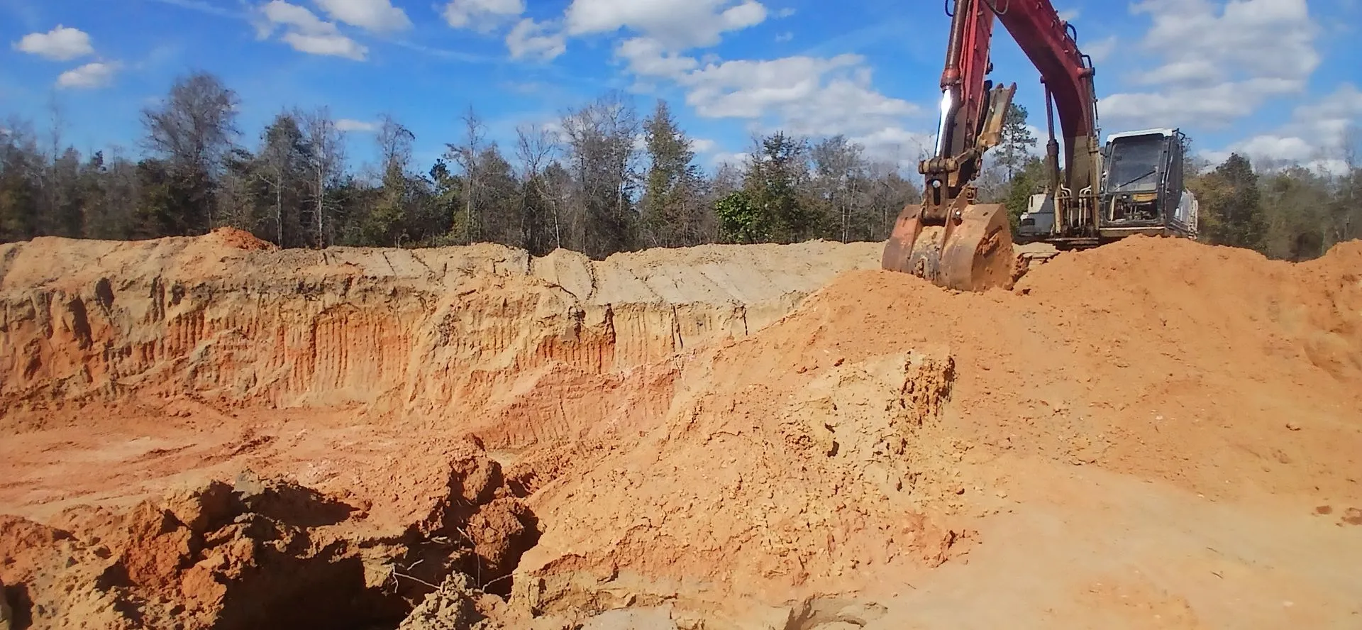 Excavator on top of the cut