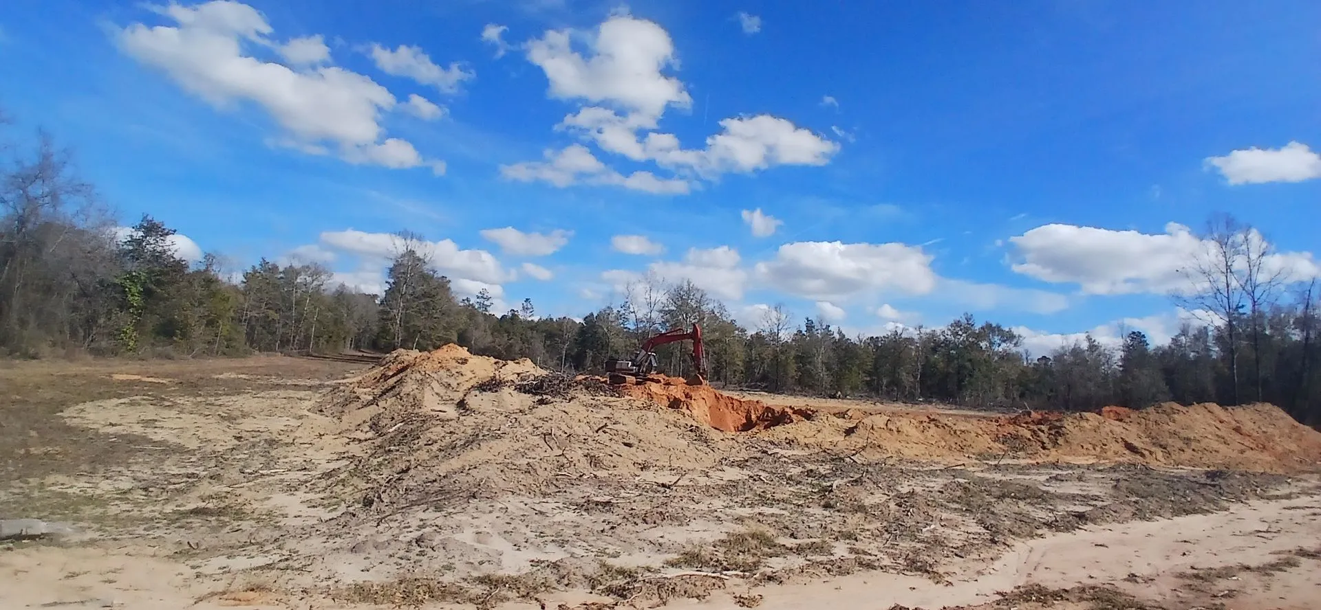 Stockpiled material at the edge of the pit